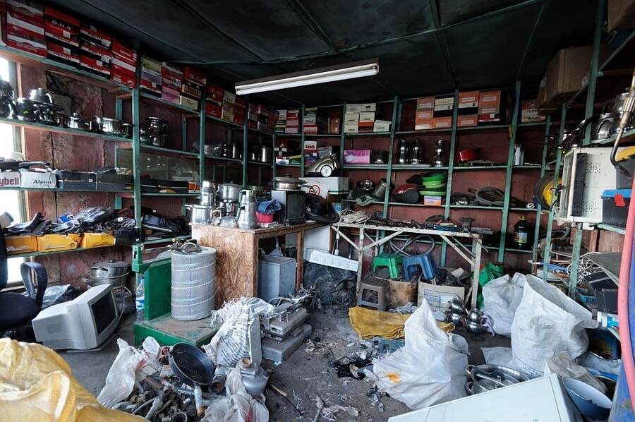 a picture of a garage that is full of junk that is not used anymore