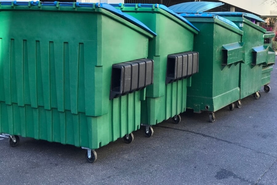 a picture of four dumpster that is rented in amherst ny